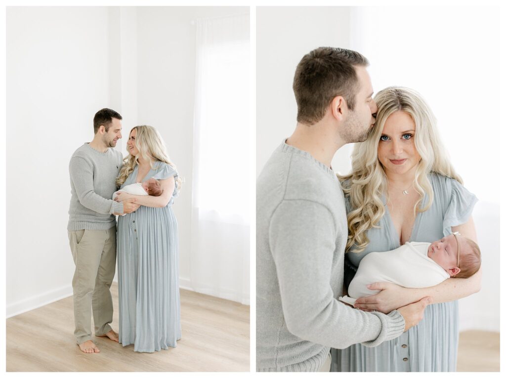 Mom and dad holding their babygirl in a natural light studio captured by Philadelphia Newborn Photographer Tara Federico