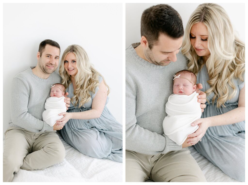 Mom and dad snuggling their babygirl in a natural light studio captured by Philadelphia Newborn Photographer Tara Federico