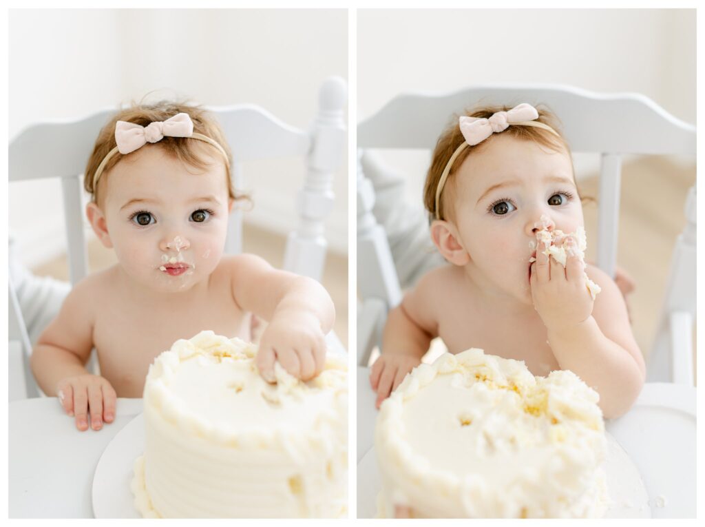 adorable red head baby girl wearing a bink bow in her hair as she enjoys her birthday cake during her First Birthday Photoshoot with Tara Federico Photography