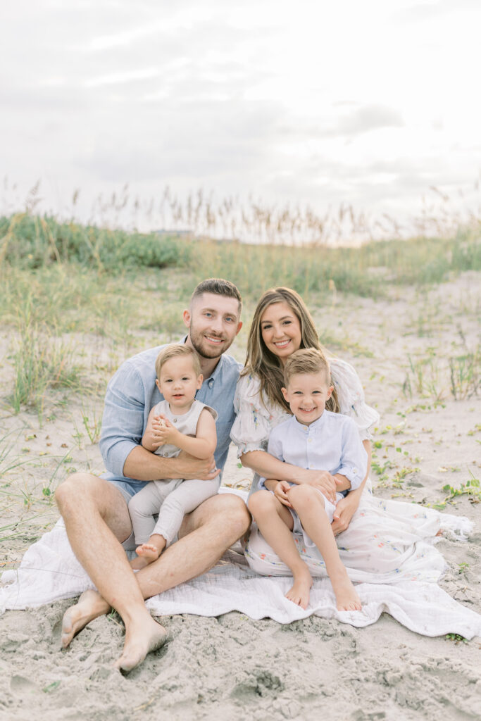 Federico family smiling together on Isle of Palms beach during sunrise