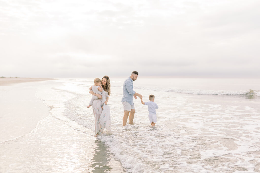 Portrait of the Federico family against a beautiful sunrise over the ocean on Isle of Palms beach