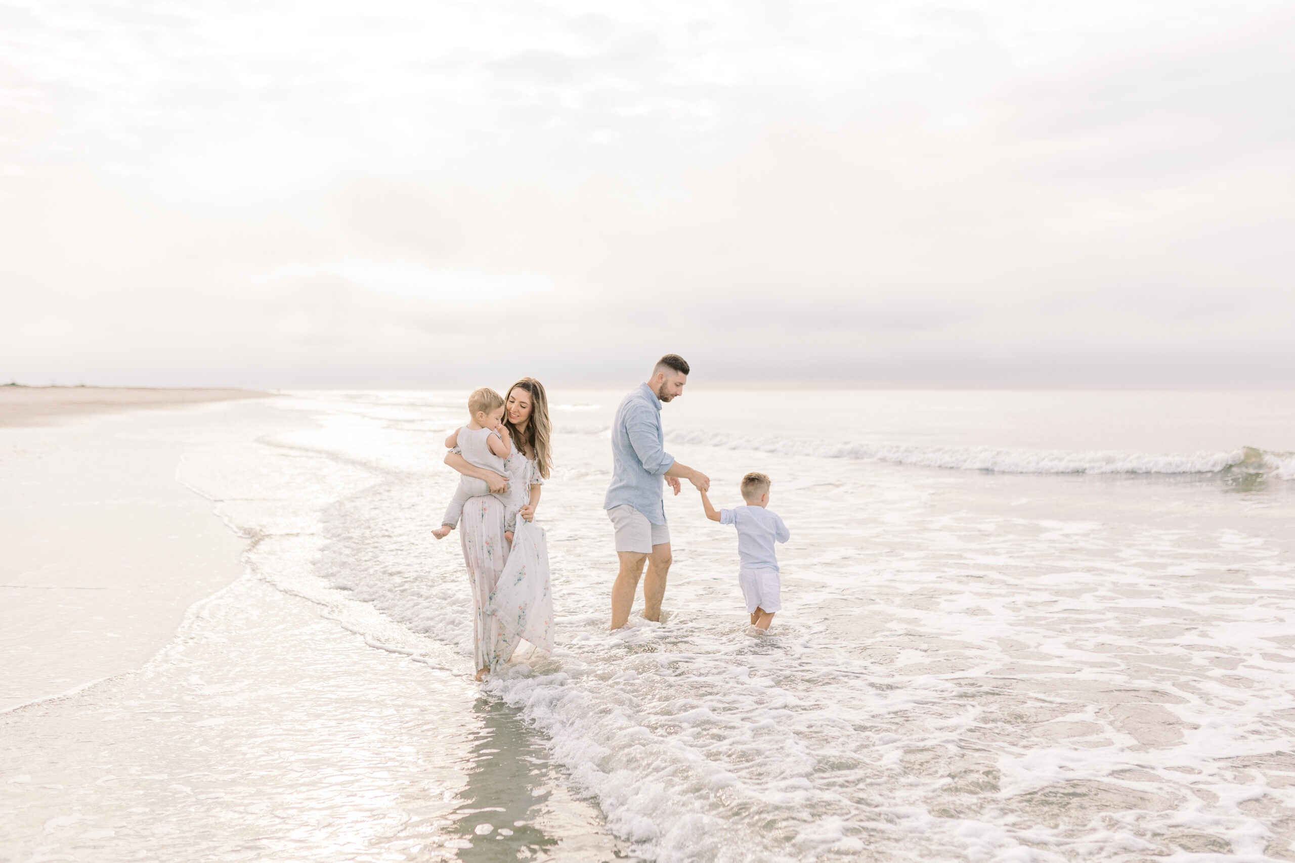Portrait of the Federico family against a beautiful sunrise over the ocean on Isle of Palms beach