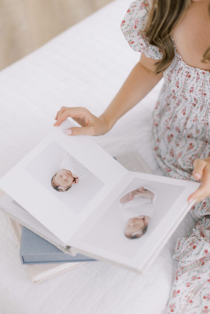 Close up shot of a newborn session heirloom album in Charleston newborn photographer, Tara Federico's, studio