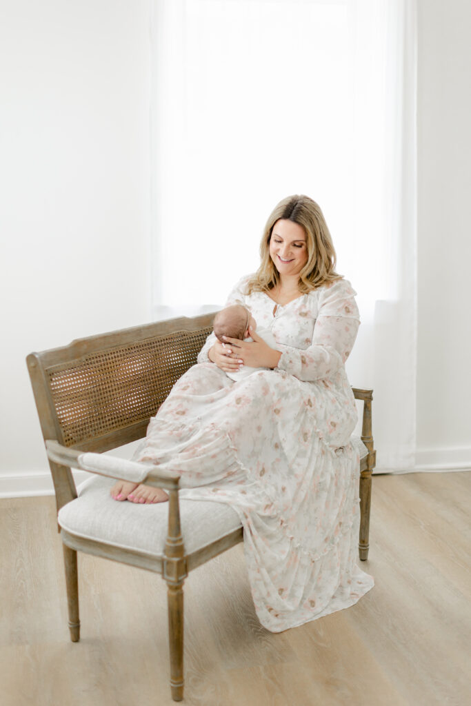 Beautiful mom adoring her sweet newborn during their Charleston Newborn Photography session